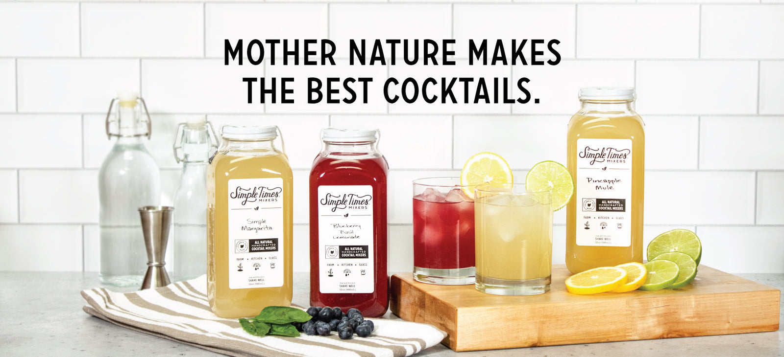 Simple Times Mixers bottles and cocktails with fruit on white tile; headline MOTHER NATURE MAKES THE BEST COCKTAILS