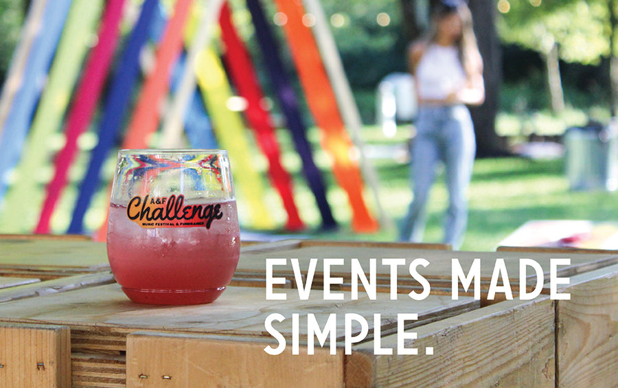 Branded pink cocktail in glass on wooden crate at outdoor event, overlaid text EVENTS MADE SIMPLE
