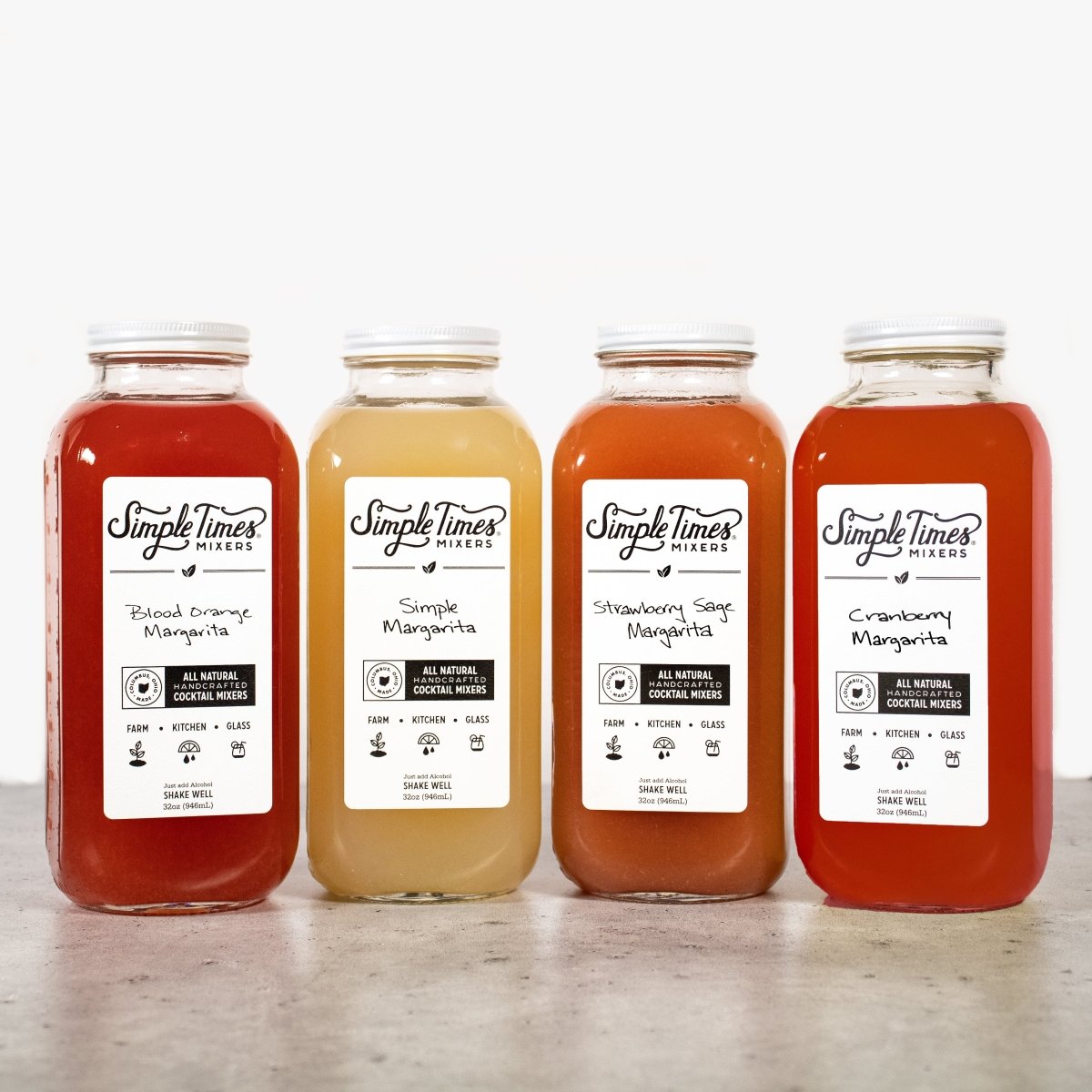 Front view of Margarita Bundle with four 32-ounce bottles in Simple, Cranberry, Strawberry Sage, and Blood Orange flavors