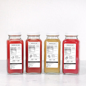 Rear view of Margarita Madness 4-Pack showcasing four 8-ounce cocktail mixer bottles with a white background