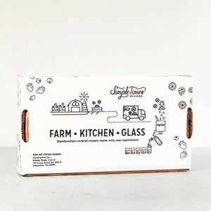 Front view of Margarita Madness 4-Pack gift box with Simple Times Farm Kitchen Glass design on a light background