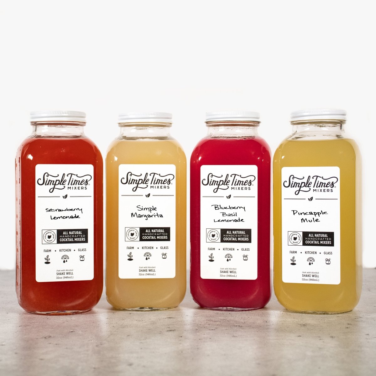 Front view of Summertime Bundle with four cocktail mixers on a countertop