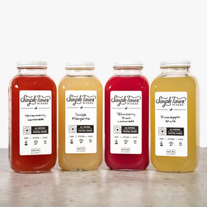 Front view of Summertime Bundle with four cocktail mixers on a countertop