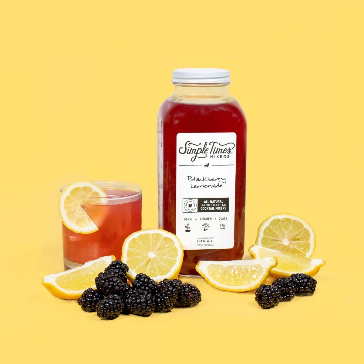 Front view of Blackberry Lemonade cocktail mixer bottle with a red drink, lemon slices, and blackberries on a yellow background