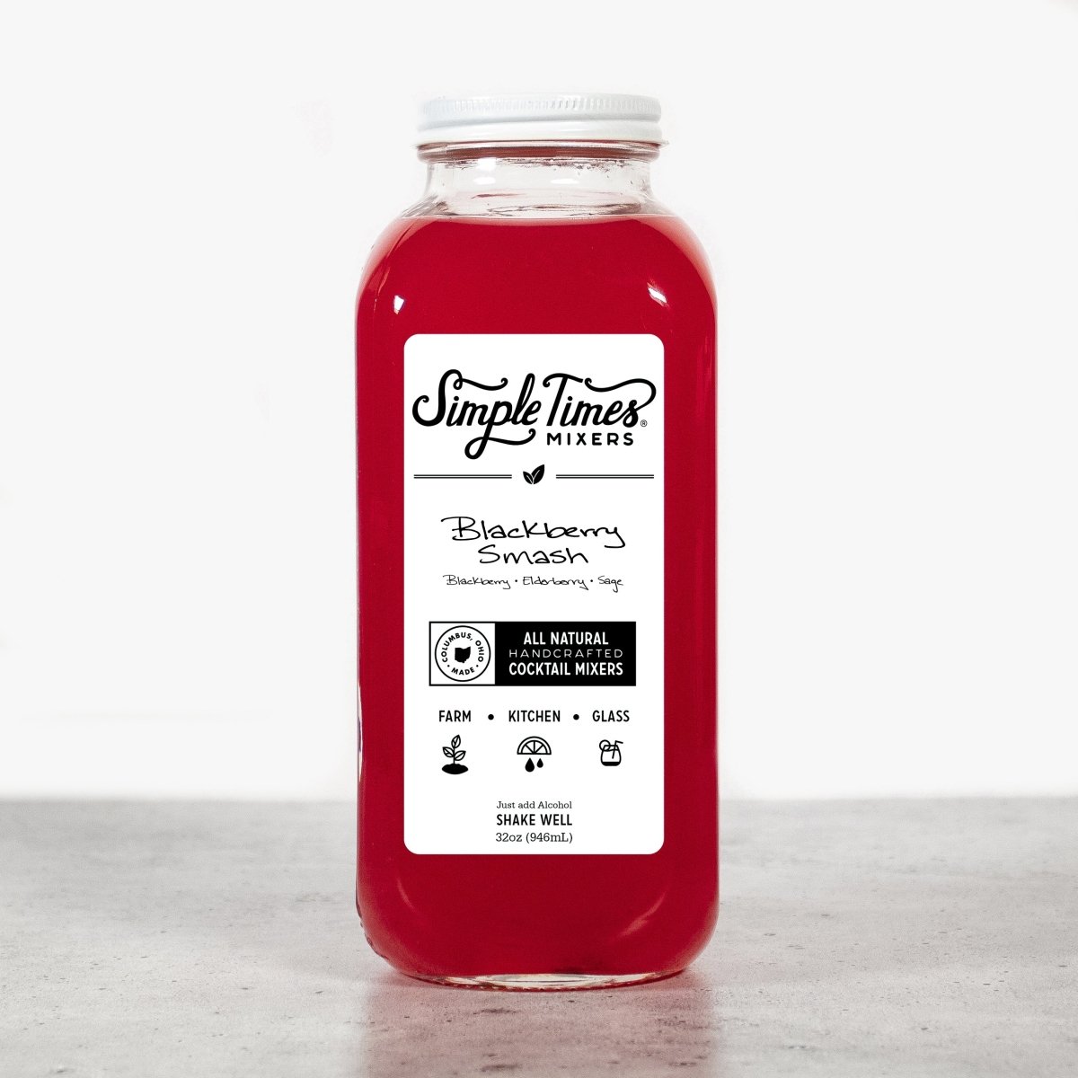 Front view of Blackberry Smash cocktail mixer bottle showcasing red berry mixer and white label on a light background
