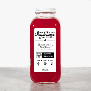 Front view of Blackberry Smash cocktail mixer bottle showcasing red berry mixer and white label on a light background