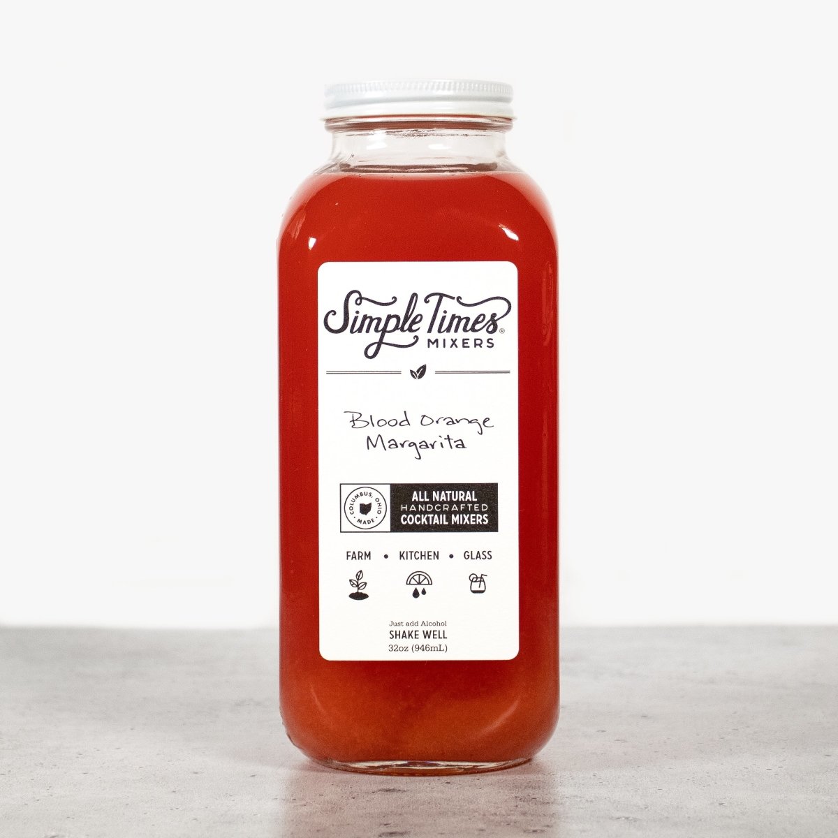 Front view of Blood Orange Margarita cocktail mixer bottle showcasing red mixer and white label on a light background