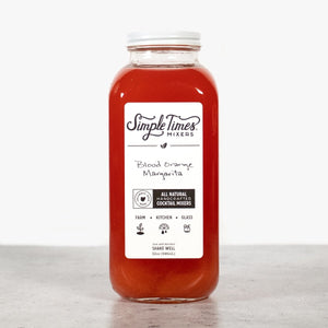 Front view of Blood Orange Margarita cocktail mixer bottle showcasing red mixer and white label on a light background