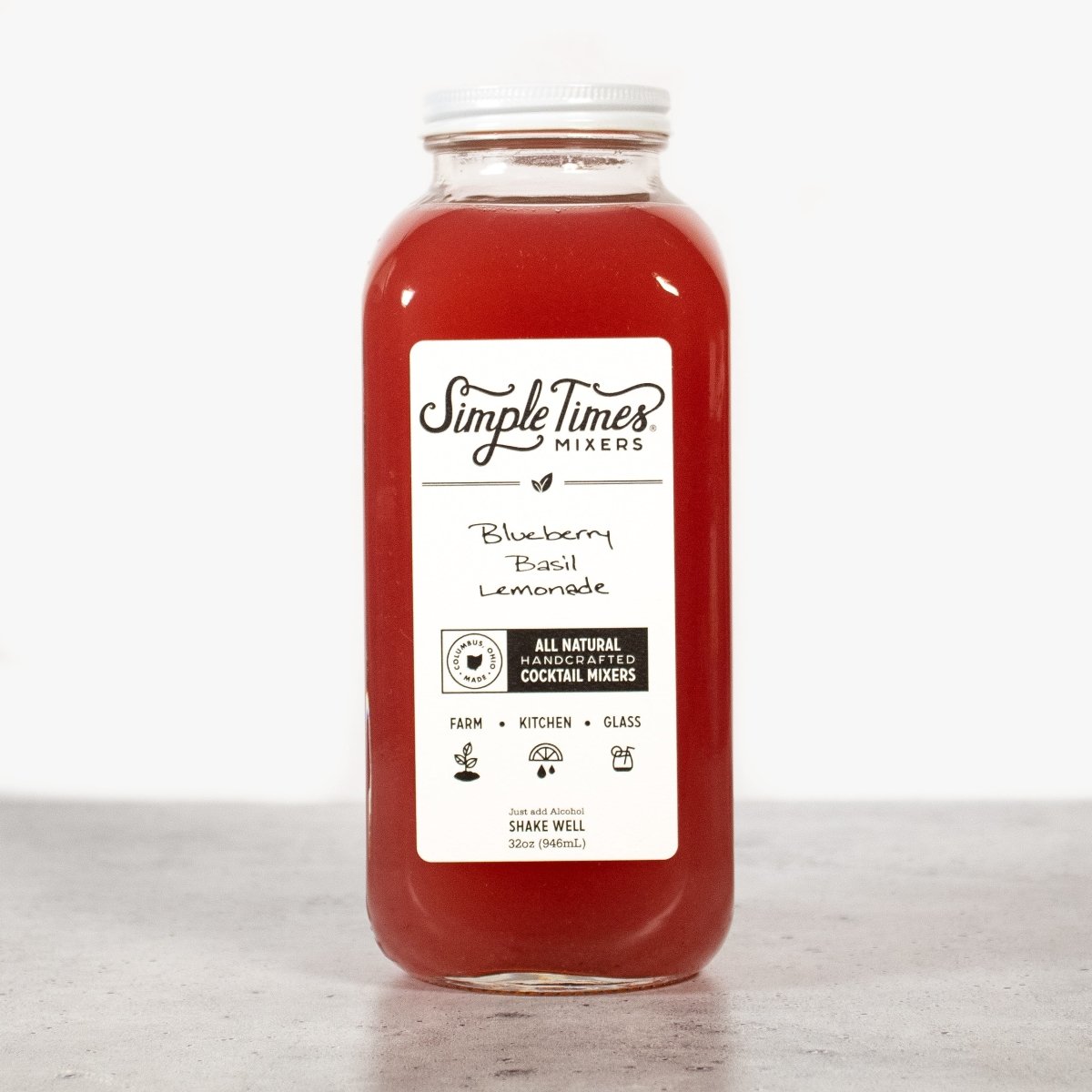 Front view of Blueberry Basil Lemonade cocktail mixer in a 32 ounce bottle showcasing its all natural label