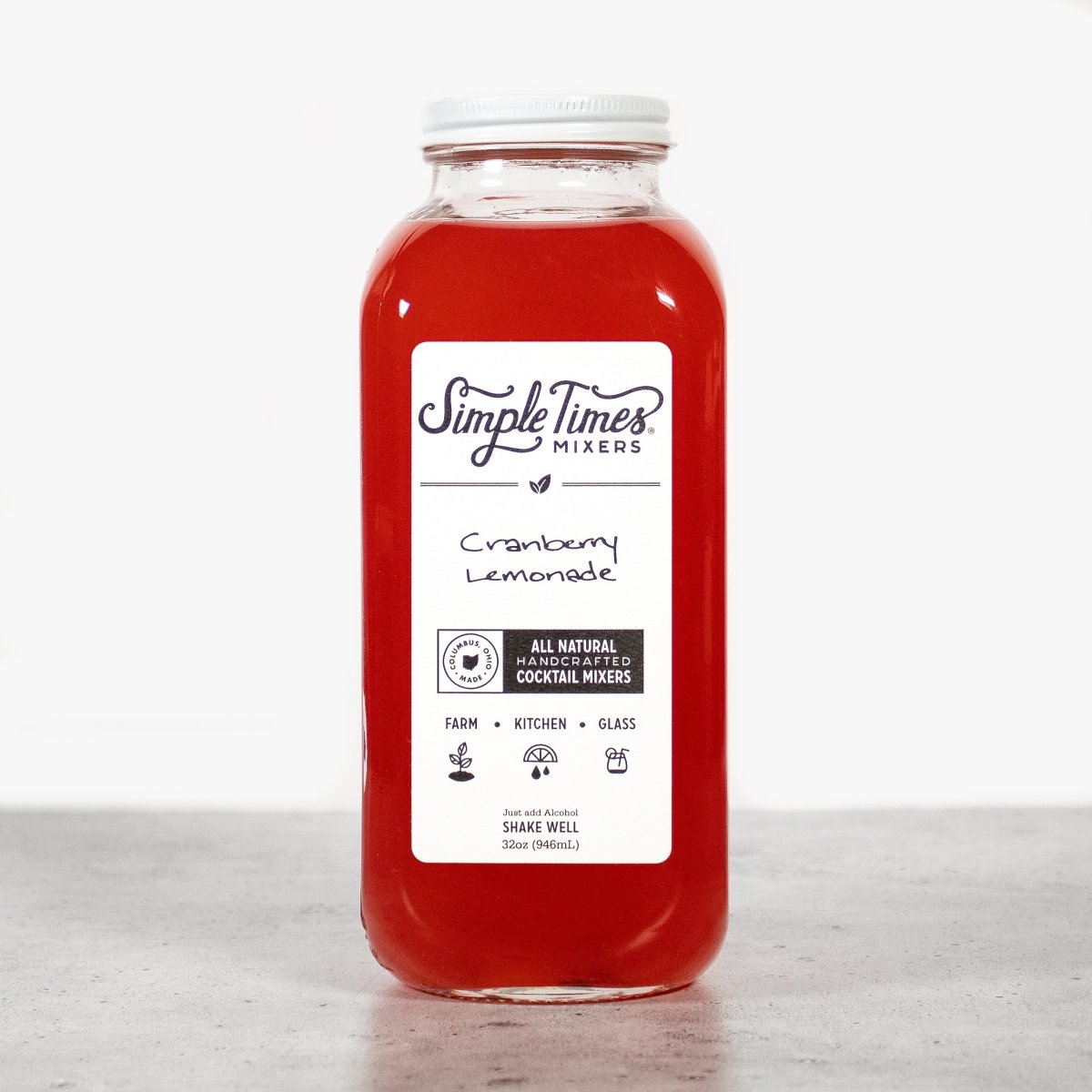 Front view of Cranberry Lemonade cocktail mixer bottle showcasing its red color, front label, and 32-ounce size against a white background