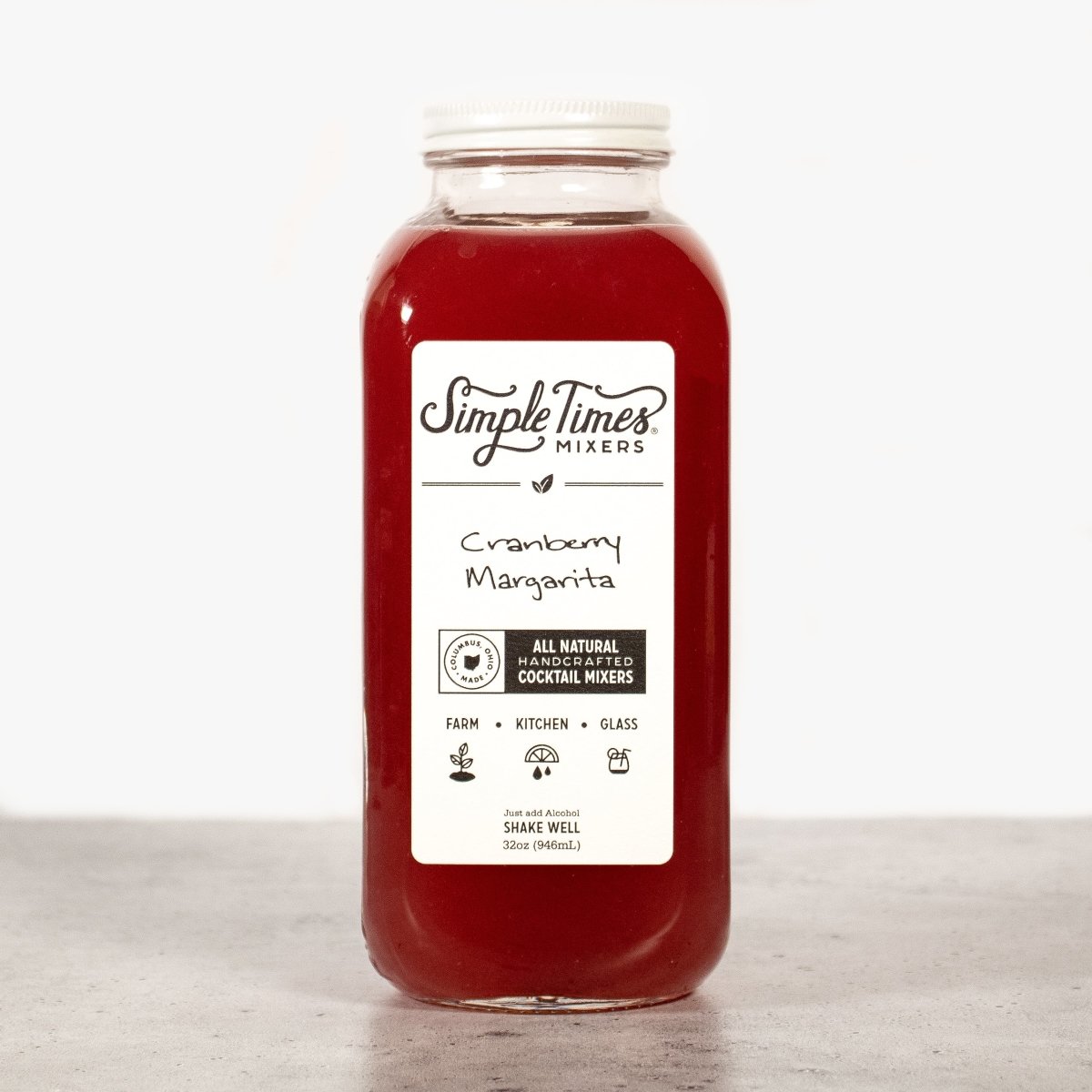 Front view of a 32oz Cranberry Margarita cocktail mixer bottle showcasing red mixer and white label on a light background