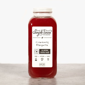 Front view of a 32oz Cranberry Margarita cocktail mixer bottle showcasing red mixer and white label on a light background