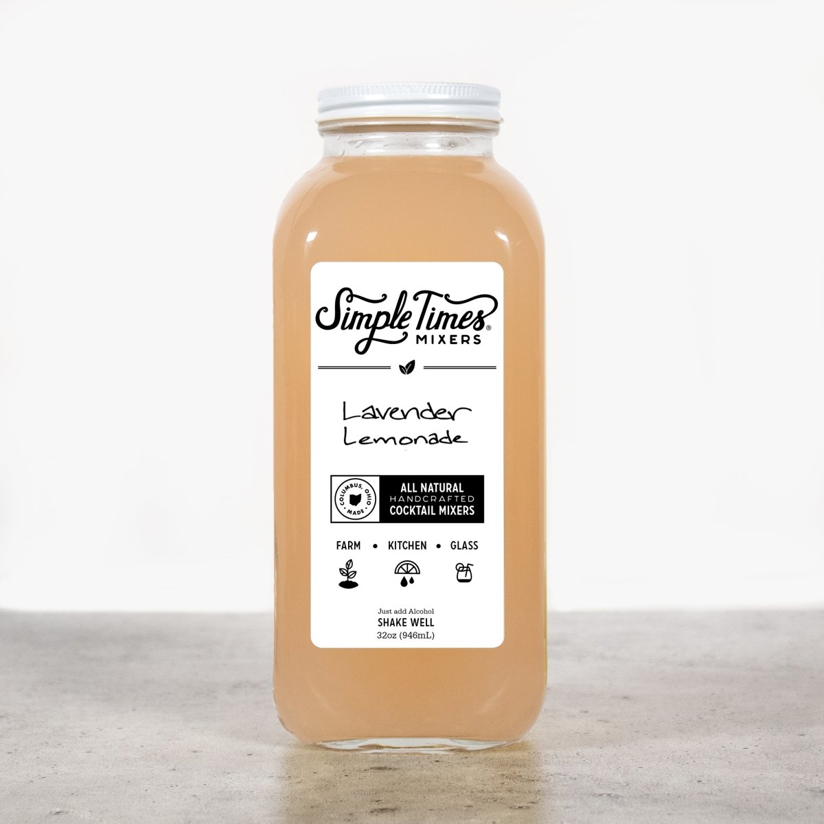 Front view of Lavender Lemonade cocktail mixer showcasing its 32oz bottle and label on a light gray countertop