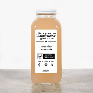 Front view of Lavender Lemonade cocktail mixer showcasing its 32oz bottle and label on a light gray countertop
