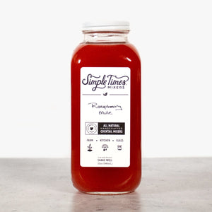 Front view of Raspberry Mule cocktail mixer bottle showcasing red mixer in a clear bottle on a light background