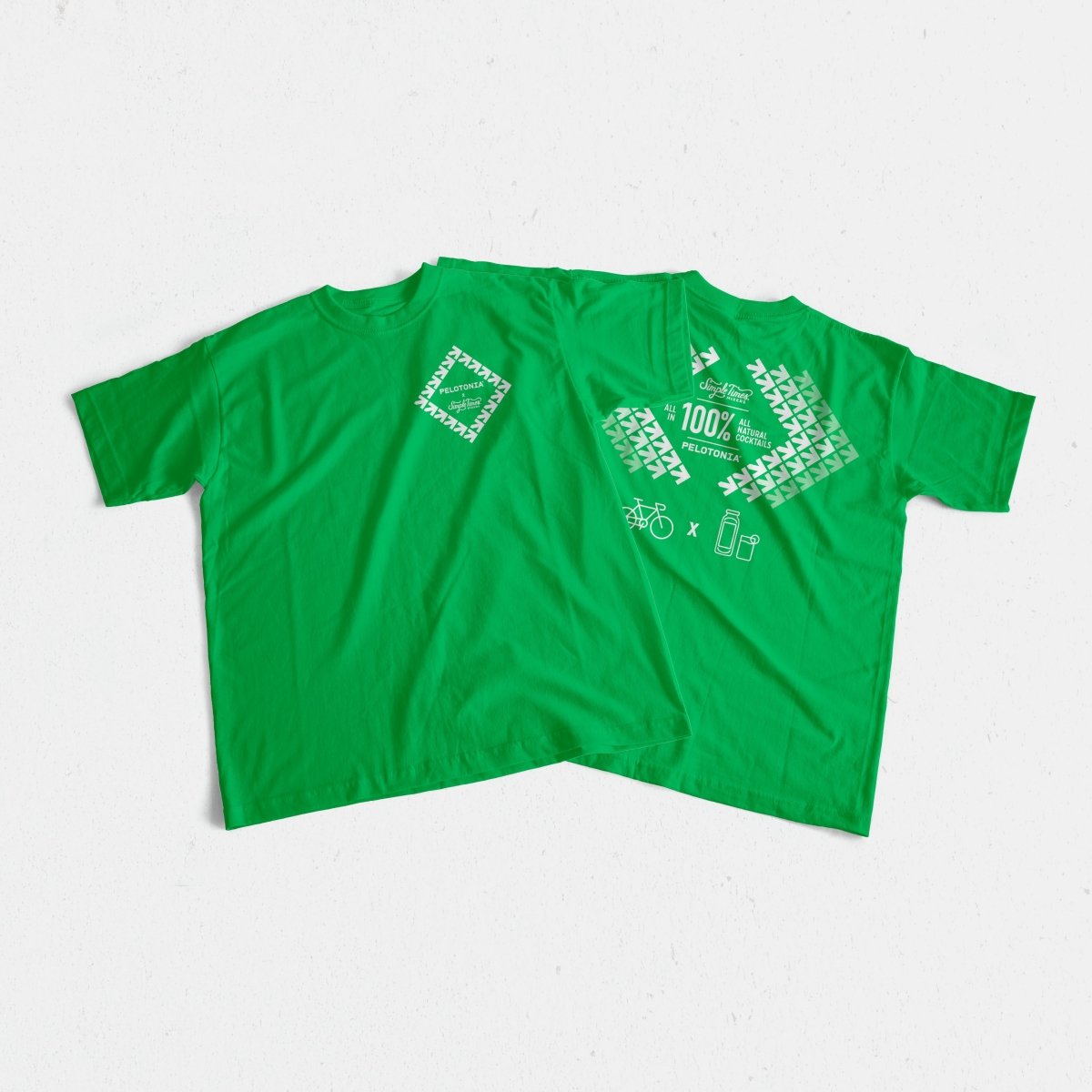 Front view of green Pelotonia T-shirt showcasing white chest graphics on a light background
