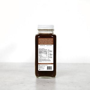 Back view of Espresso Martini cocktail syrup bottle showing nutrition facts and ingredients label on white background